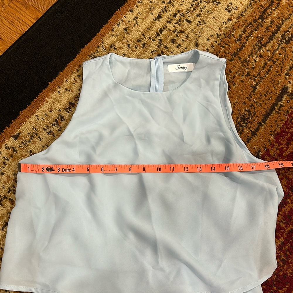 Joteisy light blue ruffle romper. Size medium.